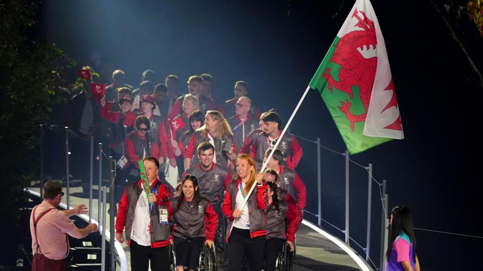 Welsh team carrying their flag