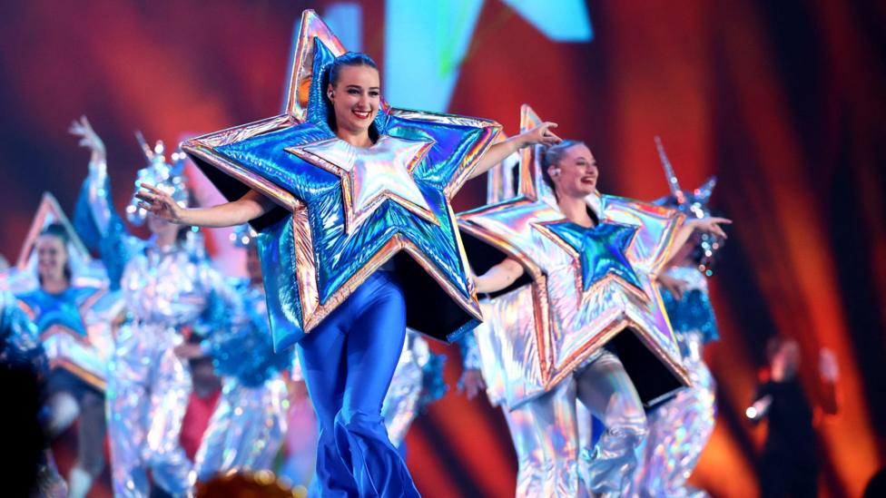dancers in star outfits