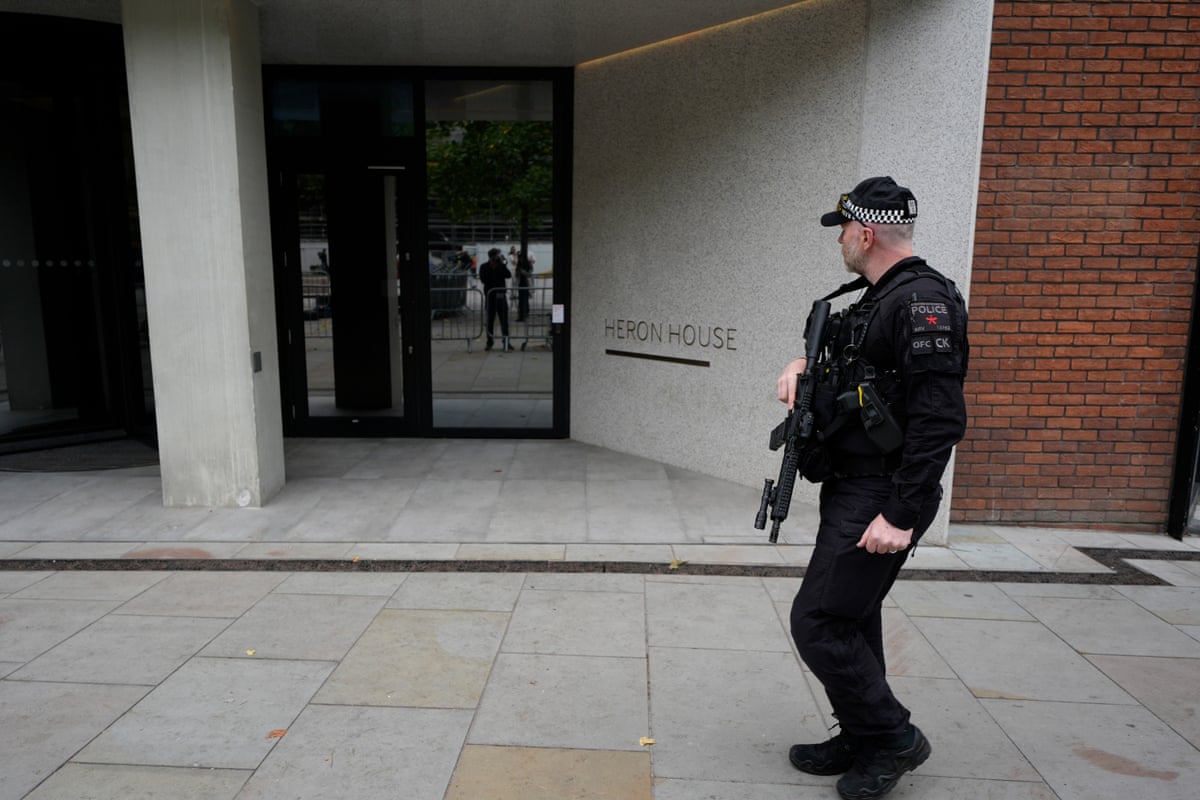 A police officer outside No 10 North, located in Heron House, central Manchester.