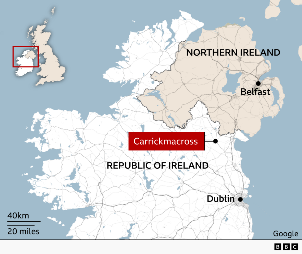 Map of the island of Ireland showing the location of Carrickmacross in County Monaghan, close to the border between the Republic of Ireland and Northern Ireland. Northern Ireland is shaded in beige and labelled, with Belfast marked to the east. The Republic of Ireland is shown in light grey, with Dublin marked on the east coast. An inset map of the British Isles highlights the island of Ireland.