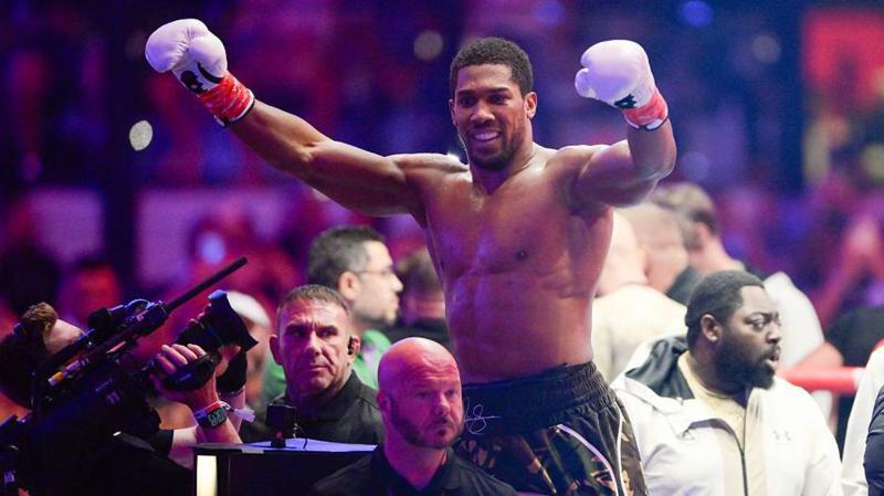 Anthony Joshua with his hands raised