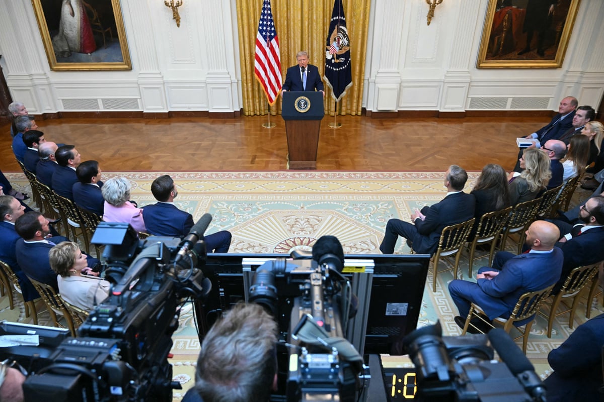 a man in front of cameras