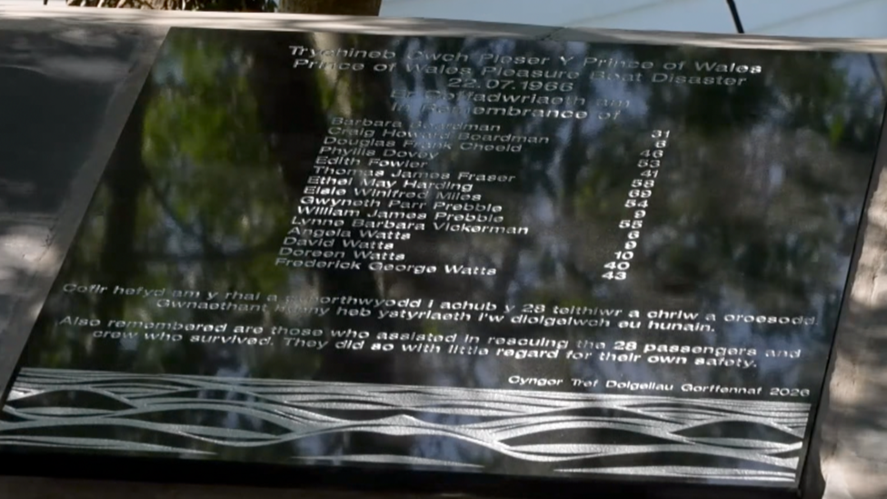 A plaque to the victims of the Penmaenpool pleasure boat disaster, listing all the names of the 15 who died in 1966