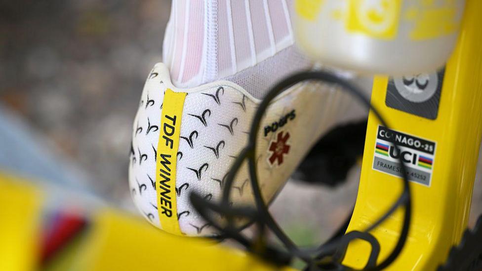 A close-up of Tadej Pogacar's cycling shoes