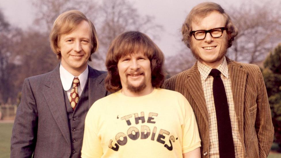Bill Oddie in a yellow T-shirt with