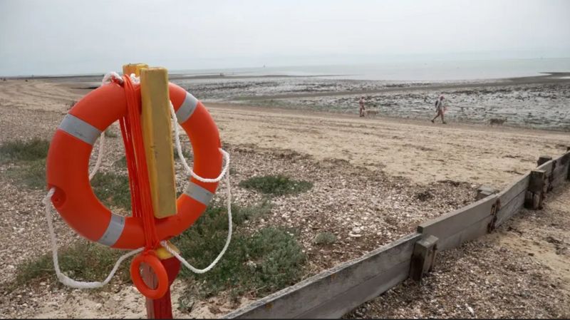 A close-up of a lifebuoy on West Mersea beach