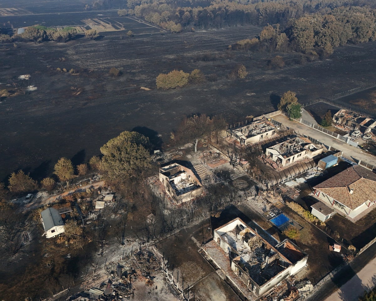 A drone view shows burnt buildings in an area affected by a wildfire in Le Porge, Gironde, France.