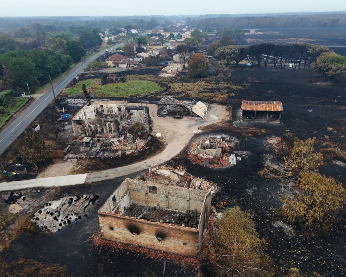 A drone view shows burnt houses in an area affected by wildfire, in Le Porge, Gironde, France.