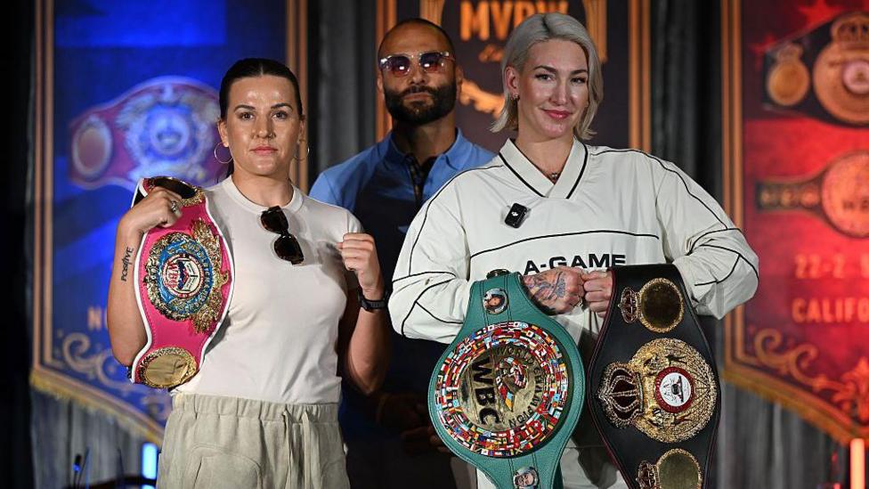 Chantelle Cameron and Mikaela Mayer pose with their belts