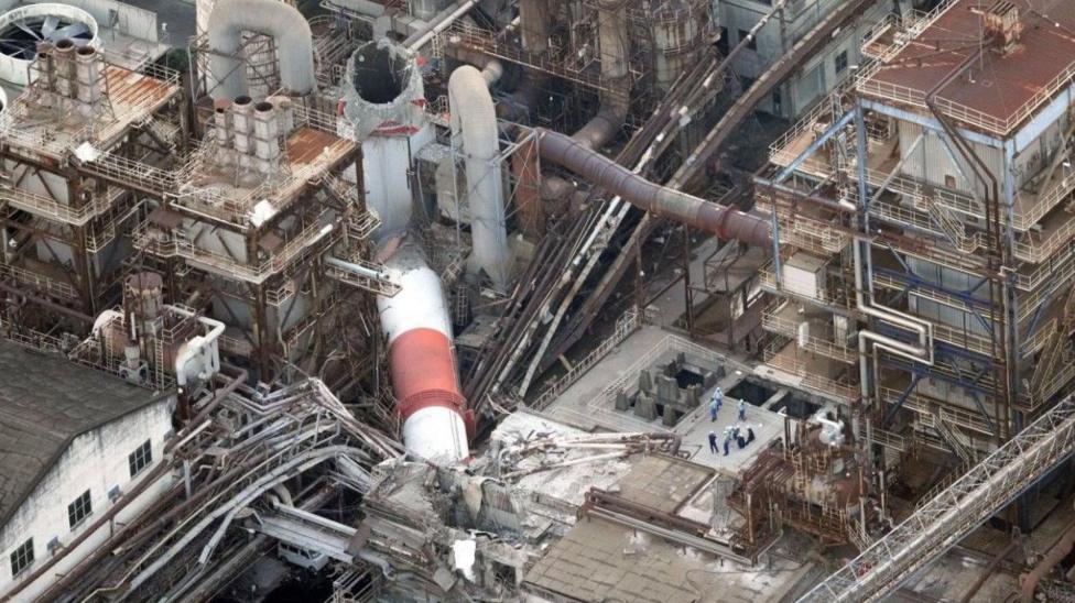 An aerial view shows a collapsed chimney at Nippon Paper Industries' Yatsushiro Mill after the earthquake.