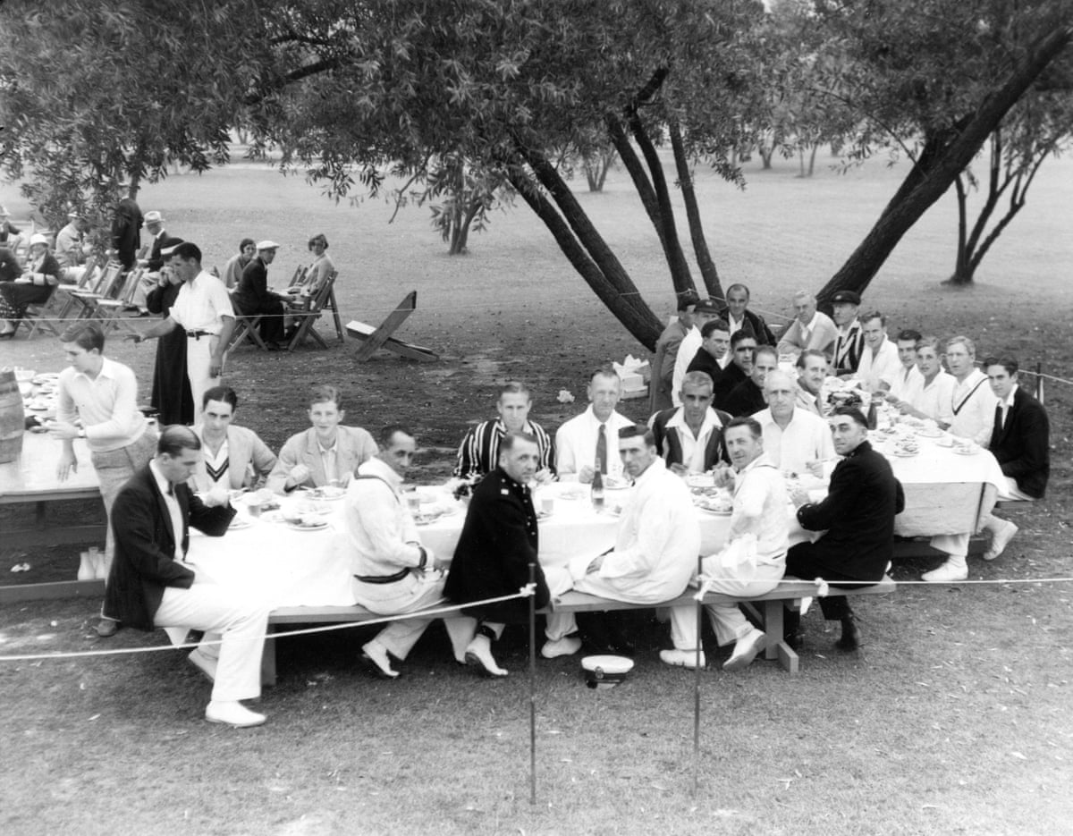 Hollywood Cricket Club members including Boris Karloff (large stripe blazer, front table, back row, second right) and Charles Aubrey-Smith (cap and blazer, right table, sixth right) at Aubrey Field in Hollywood having lunch between games with a team from the British Royal Navy’s HMS Dragon in September 1933.