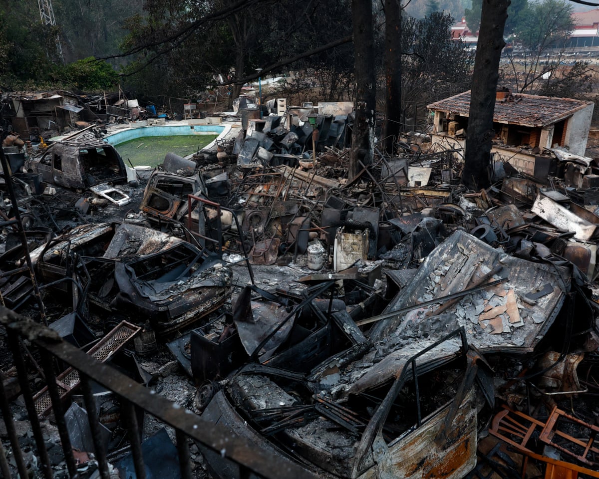 Burnt-out vehicles and twisted scrap metal amidst the rubble after a wildfire devastated the property in Pelayos de la Presa, 65 kilometers west of Madrid, Spain.