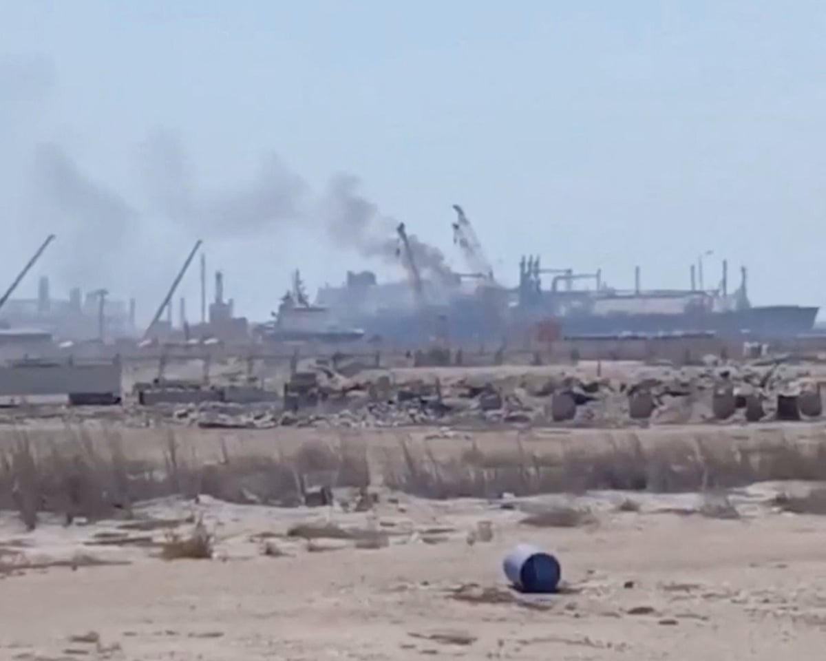 Smoke rises from a gas tanker at Damietta port in Egypt