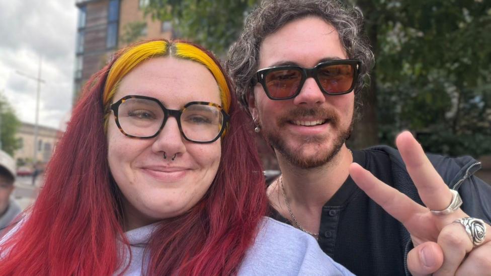 Jess Hallatt from Sheffield pictured in Belfast with Irish singer Cian Ducrot