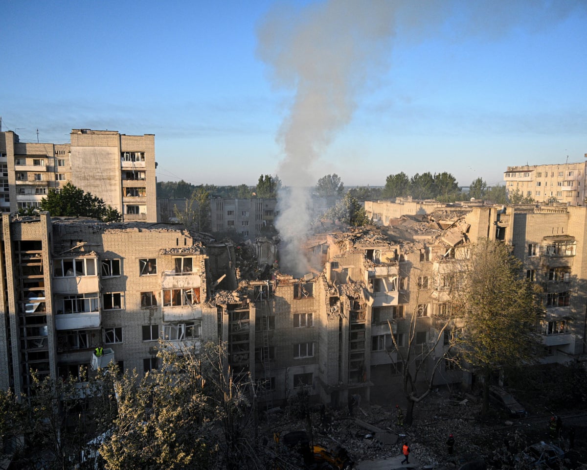 First responders operate at a residential building partially destroyed as a result of Russian missile strikes in the western Ukrainian city of Lviv.