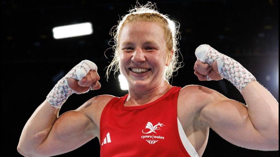 Rosie Eccles poses after winning her quarter-final bout