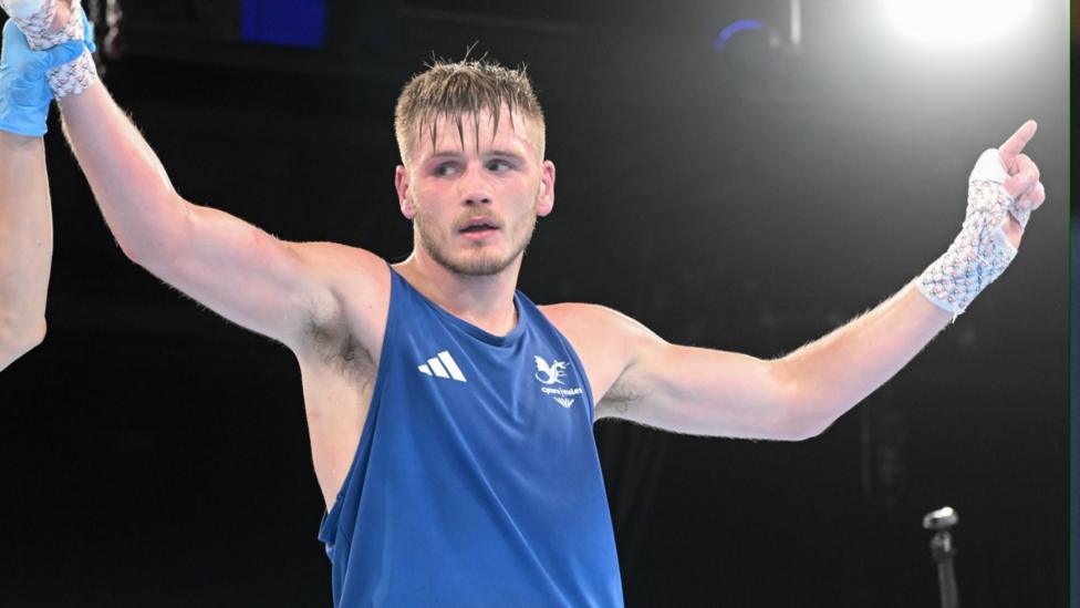 Connor Williams lifts his arms aloft after his quarter-final win.