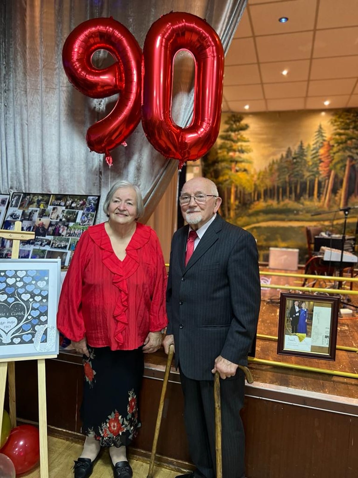 Maria and Czeslaw Krupa with a big 90 balloon at a birthday in Bury.