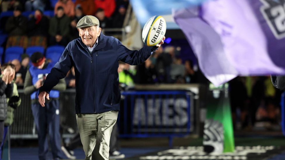 Megan Keith's grandad, Dr Murray Kirkwood, delivered the match-ball before Glasgow Warriors' URC match against Benetton in March 