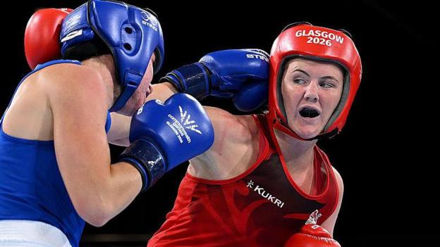 England boxer Sacha Hickey, right, fighting Australia's Eve Bryson in the women's 65kg category of the Commonwealth Games semi-finals