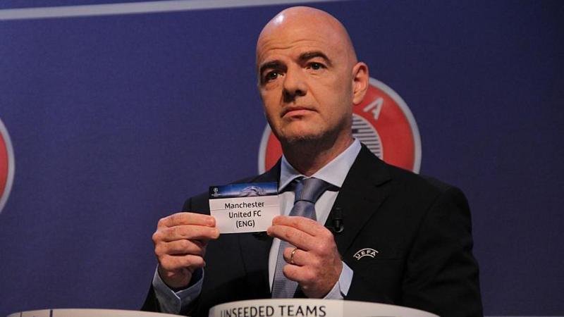 Uefa general secretary Gianni Infantino draws the name of Manchester United for the Champions League group stage of 2015-16