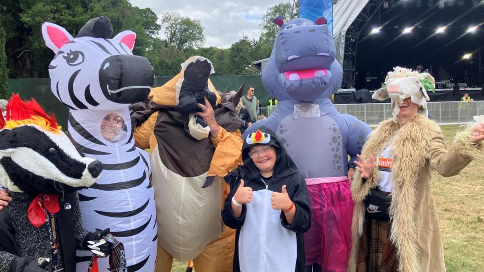 The families from Dores are dressed as different animals, including a badger, zebra, lion, hippo, goat and penguin