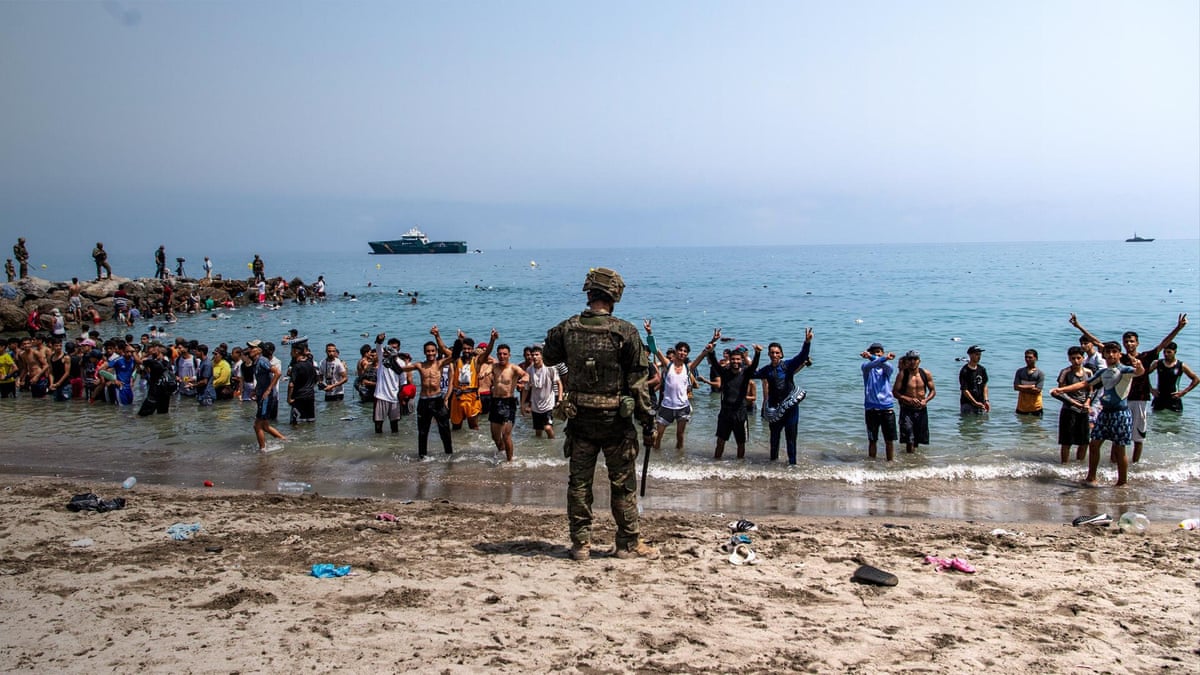Tens of thousands of migrants cross into Spanish enclave Ceuta from Morocco - video