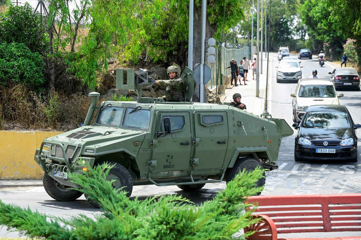 Spanish soldiers in an armoured vehicle patrol Ceuta
