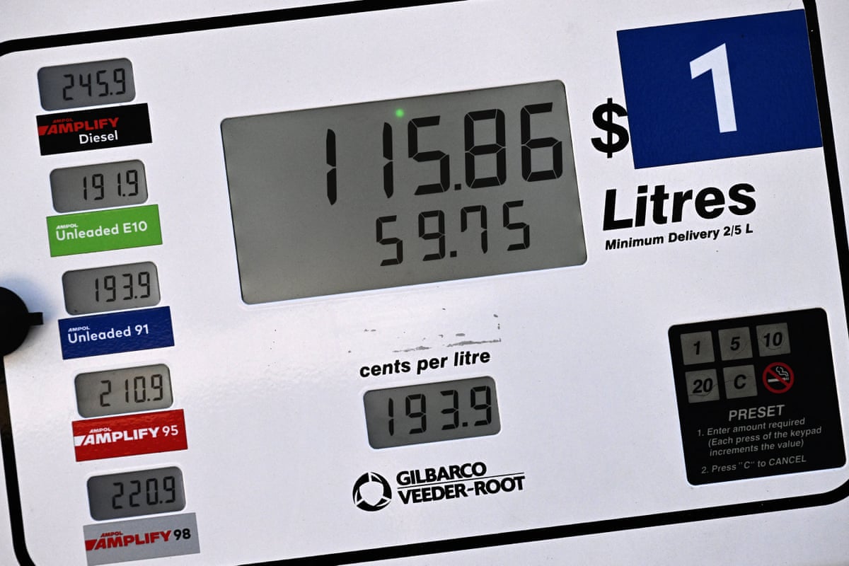Prices for different petrol grades are shown at a service station in Sydney on 31 July.