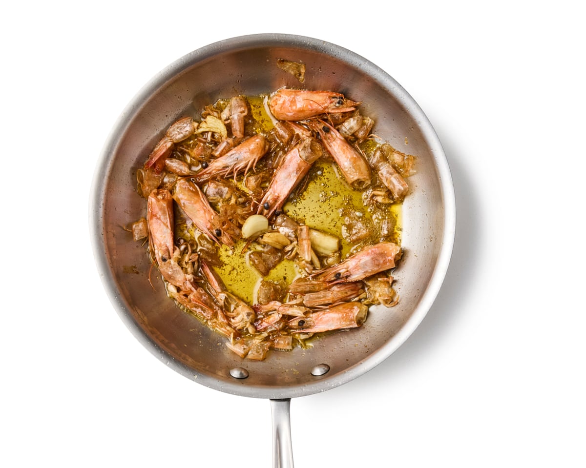 Garlic and prawn shells in a frying pan