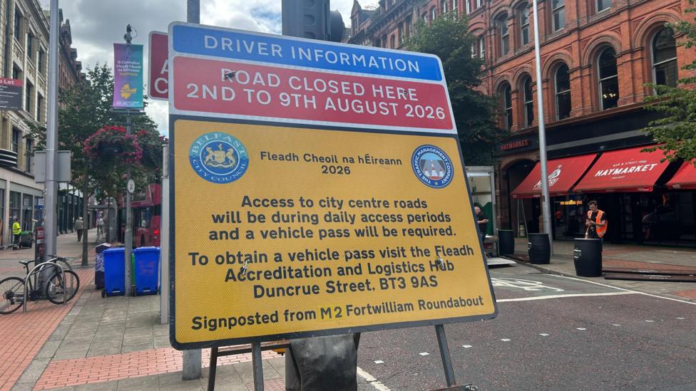 A red and yellow Belfast City Council sign outlining road closures in the city during the Fleadh. 