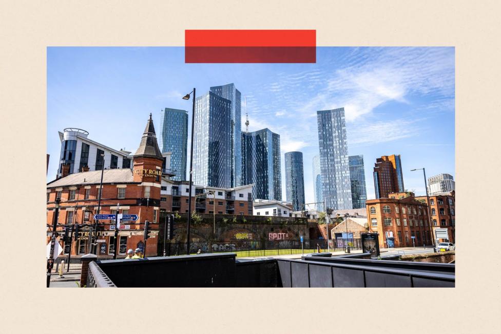 A view of the skyline in Manchester City Centre. Edwardian buildings are in the foreground with skyscrapers in the background.