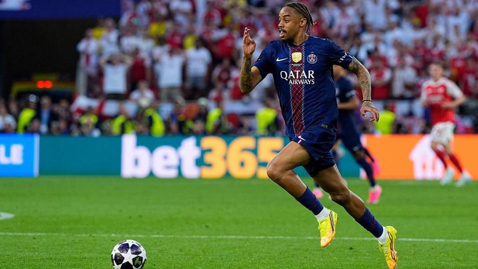 Bradley Barcola dribbles the ball forward at pace while playing for PSG in the Champions League final