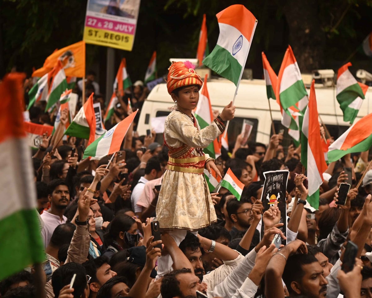 Clock it … Cockroach Janta party supporters celebrate the resignation of Dharmendra Pradhan.