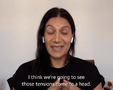 A gif of two journalists talking to each other
