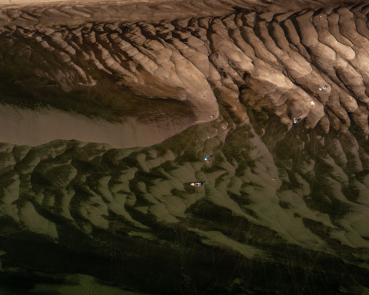 An aerial drone photo shows the exposed riverbed of the Danube River in Dunaszentbenedek, Hungary.