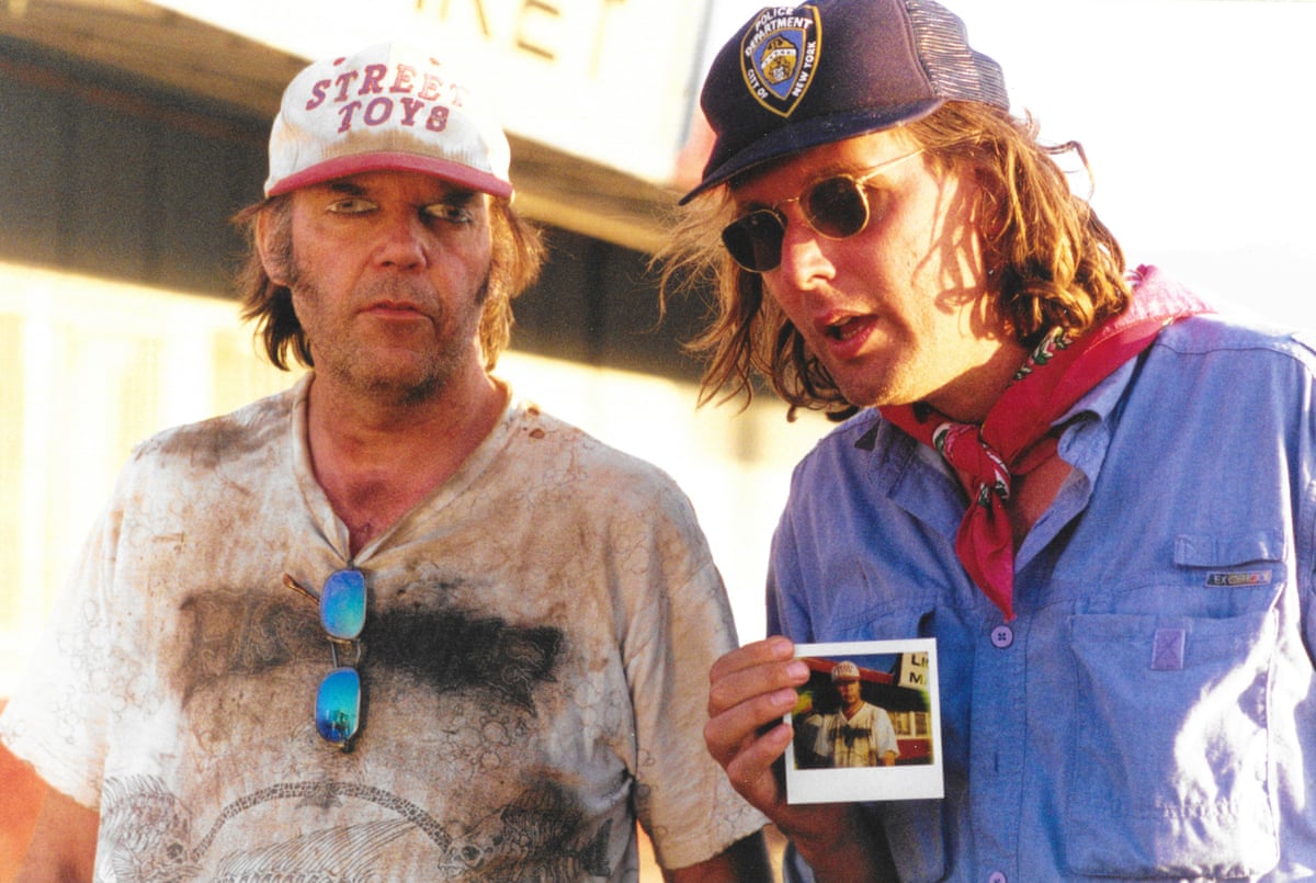 ‘I got an amazing shot past his nose’ … Neil Young, with painted-on eyes, and Pope on a shoot in 1997.
