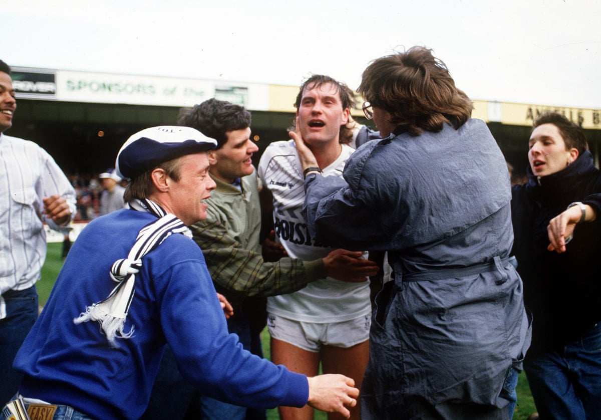 Glen Hoddle is mobbed by Spurs fans after their FA Cup semi-final victory against Watford in 1987.