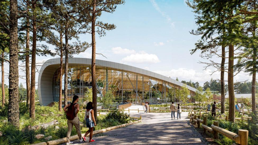 A computer generated view of the Borders Center Parcs with a swimming pool building, pathways through the trees and visitors milling about.