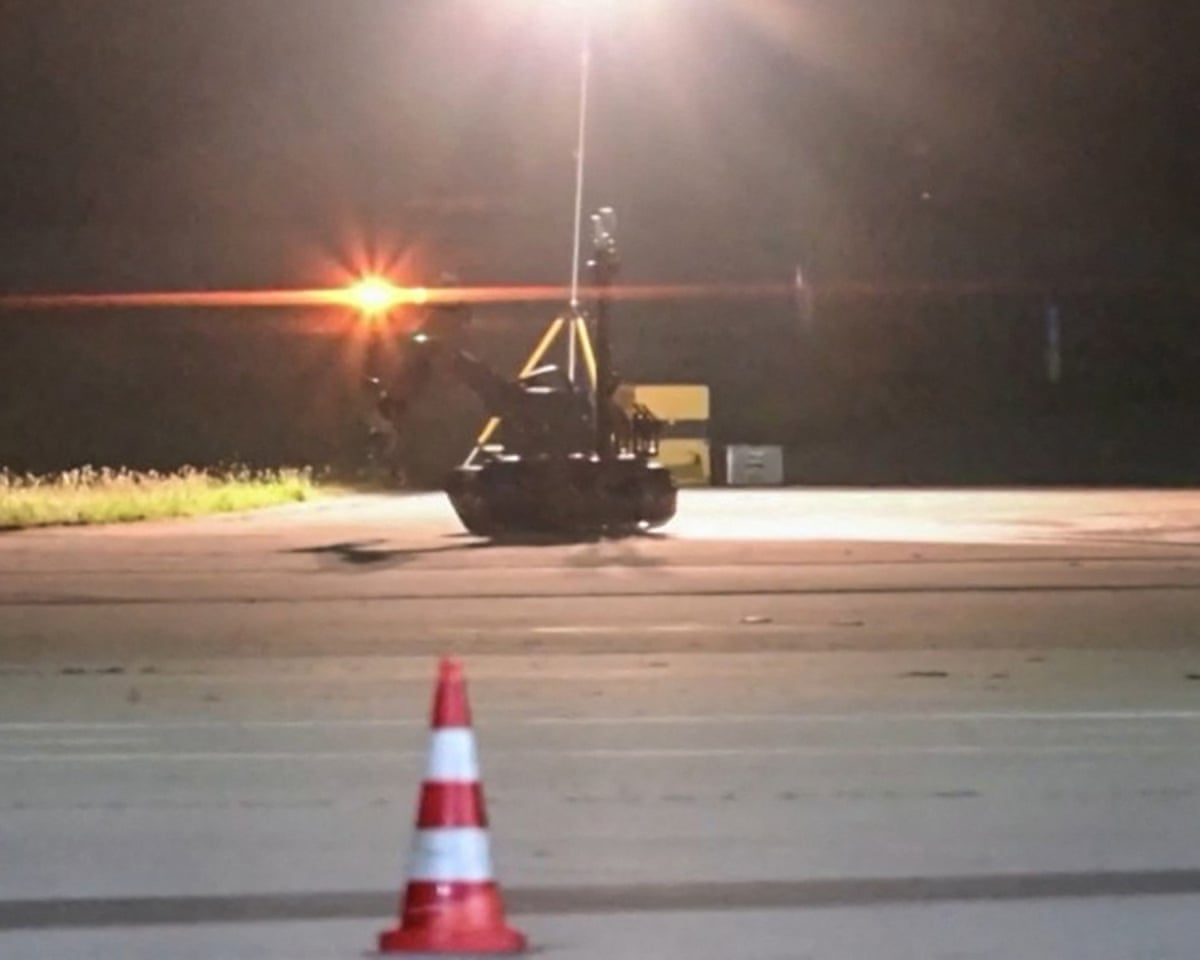 A video grab taken from a video footage by News5 shows a bomb disposal robot deployed by police at German airport Leipzig-Halle in Schkeuditz, eastern Germany, after a drone was spotted nearby.