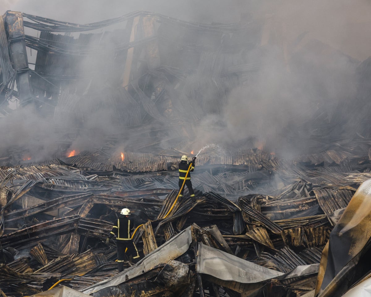 Rescuers work at the site of a Russian missile strike on a goods storage in Kyiv, Ukraine.