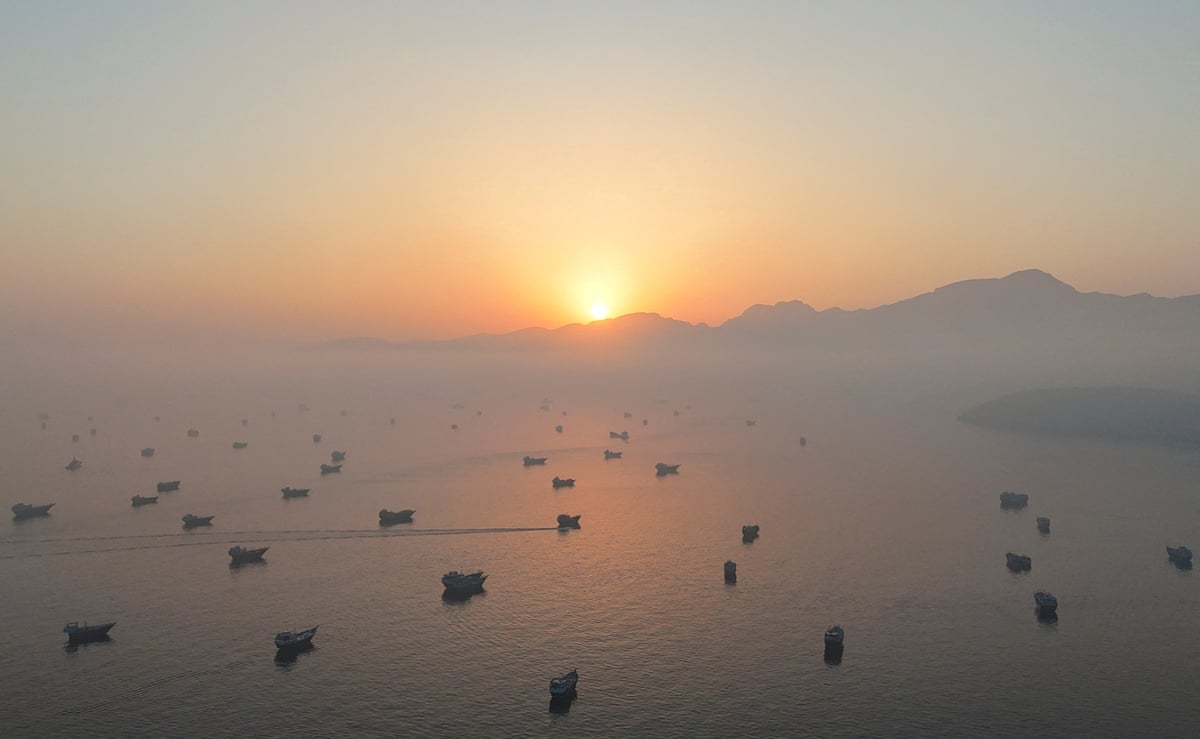 A drone view shows dozens of vessels in the strait of Hormuz.