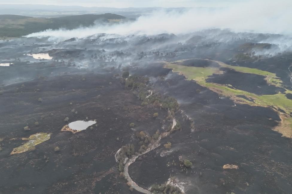 An aerial image showing a large swathe of burnt moorland.