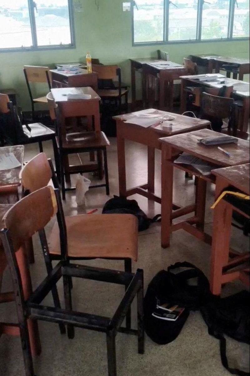 Students' belongings and furniture scattered in a classroom, following a shooting incident at Debsirin Nonthaburi School