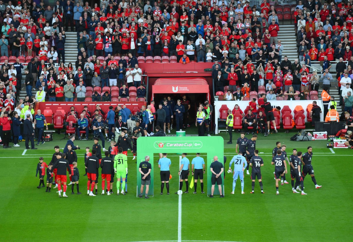 The Middlesbrough and Wrexham players line up ahead of kick-off.