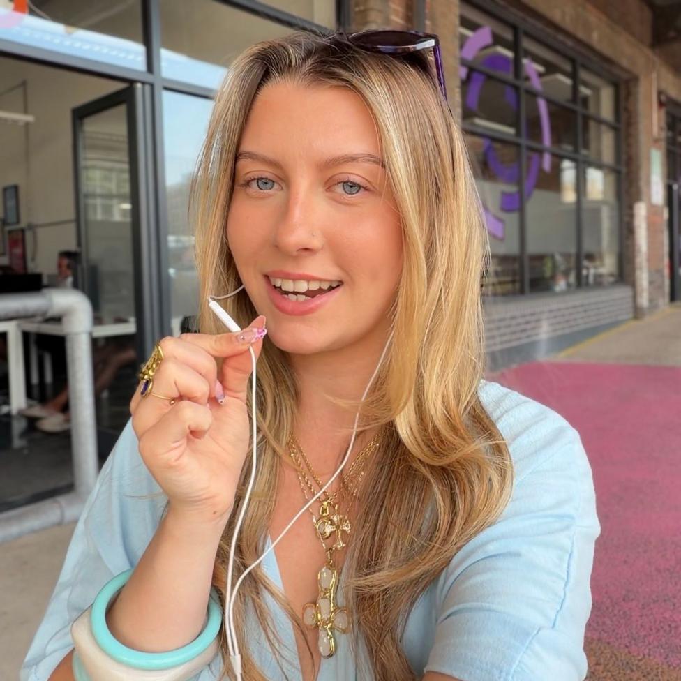 Monique Wellman-Maso using wired headphones