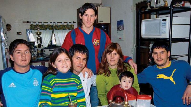 Lionel Messi poses with his brother Rodrigo, sister Maria Sol, father Jorge, mother Celia, nephew Tomas and brother Matias during a private photo session in October 2003