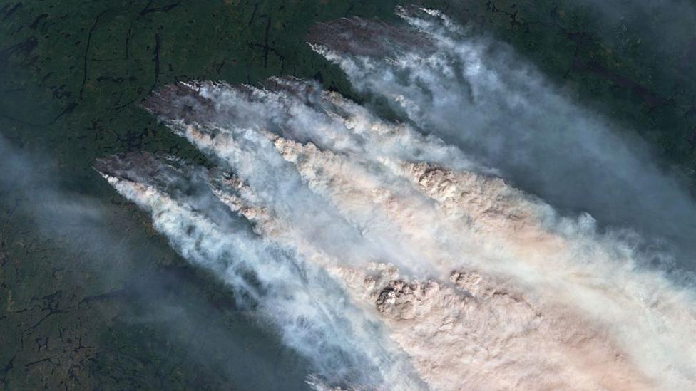 A satellite image showing wildfire smoke from fires in Northwestern Ontario in July.