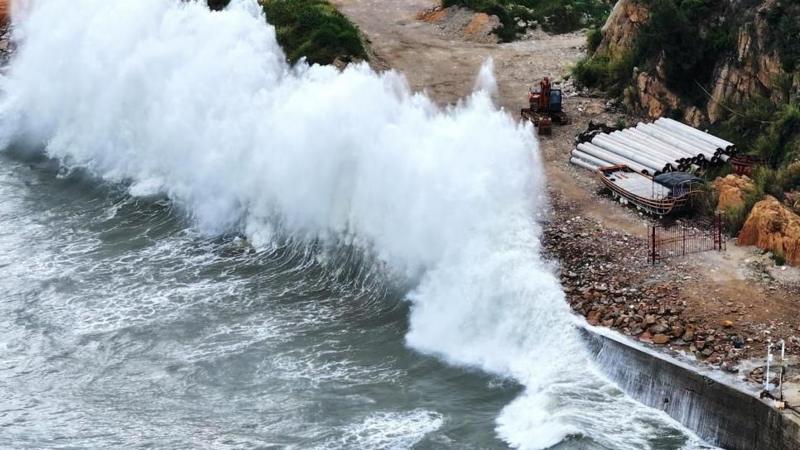 Huge waves crash on the coast of Huangqi in Lianjiang county, as Typhoon Dolphin approaches, in Fujian