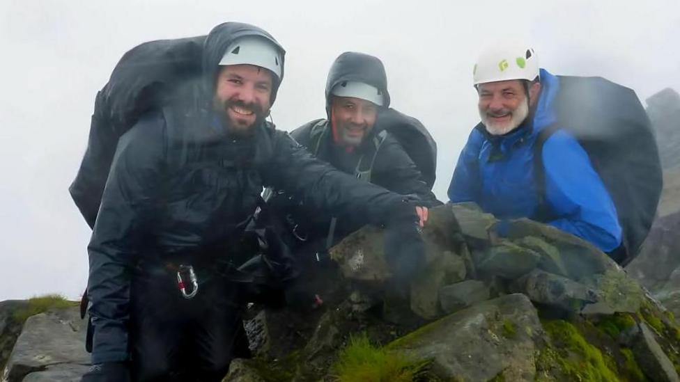 Undated handout photo issued by the MND Foundation of Paul, David, and Matt Choat. Paul Choat, 40, from Longniddry, took on the challenge of climbing all of Scotland’s tallest mountains in honour of his father. David Choat died from motor neurone disease (MND) just 15 peaks short of completing the challenge himself. He had reached 267 of Scotland’s 282 peaks over 3,000 feet when his condition made it impossible to continue. Issue date: Monday August 10, 2026. PA Photo. Photo credit should read: MND Foundation/PA Wire